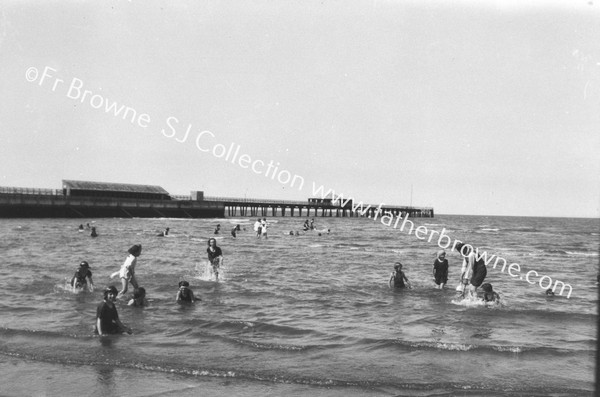 BATHERS WITH PIER